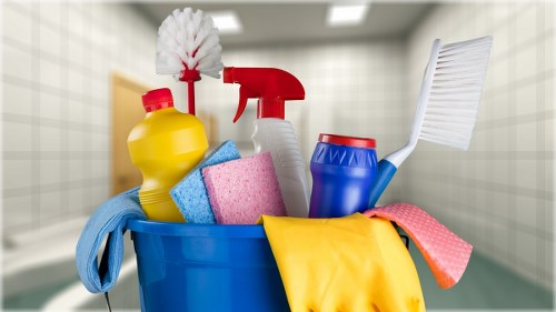 Technician preparing carpet cleaning equipment with safety focus