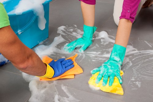 A homeowner using hook carpet cleaners on a textured carpet in a living room